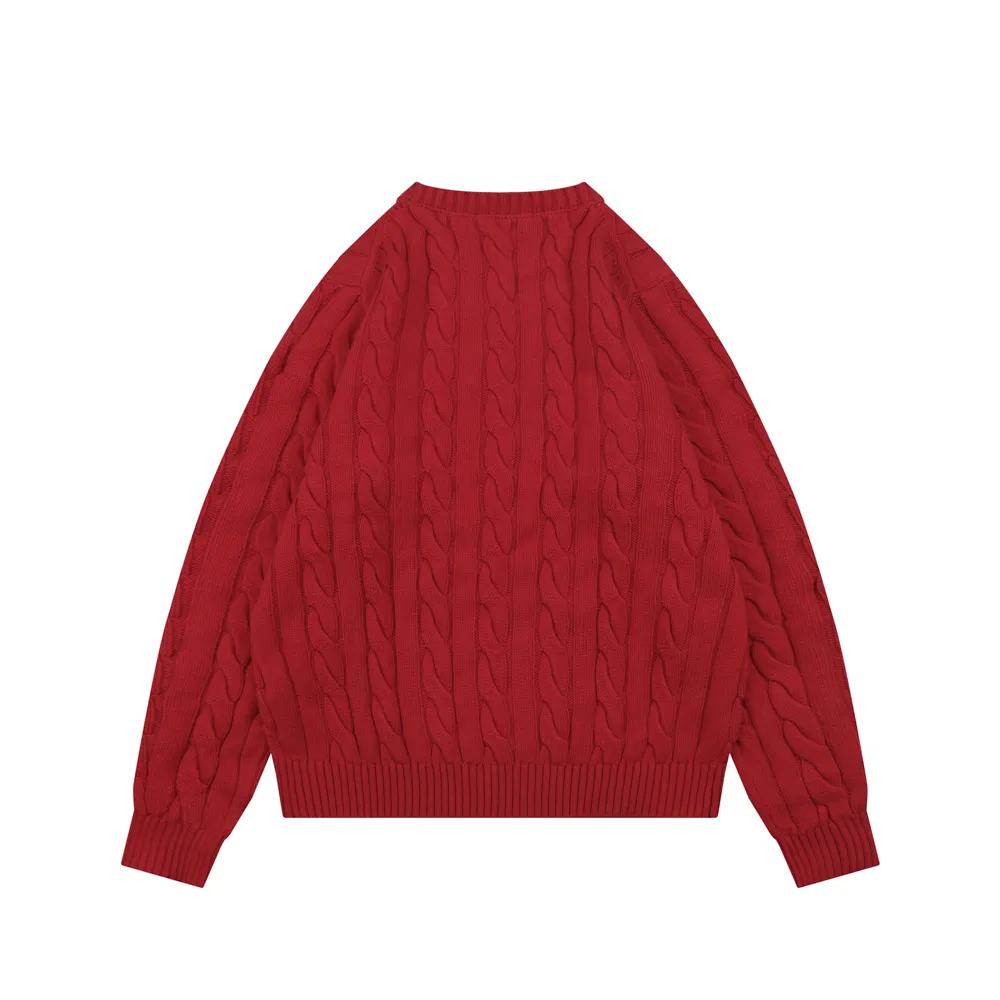 Red cable-knit sweater made of wool, featuring ribbed cuffs and hem.