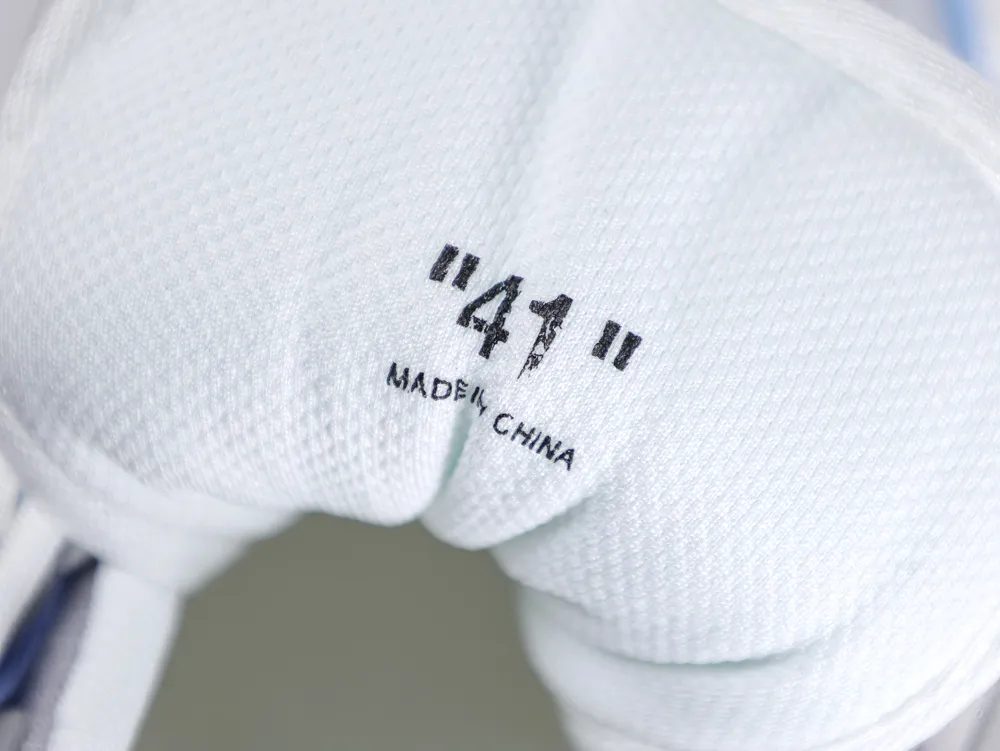 White fabric shoe tongue featuring "41" text and "Made in China" label.
