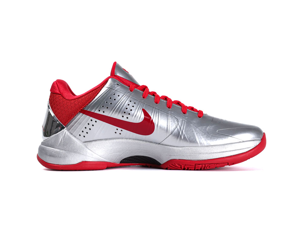Silver and red athletic shoe with synthetic material and red laces.