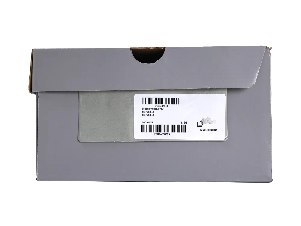 Gray cardboard shoe box with a white label displaying product details.