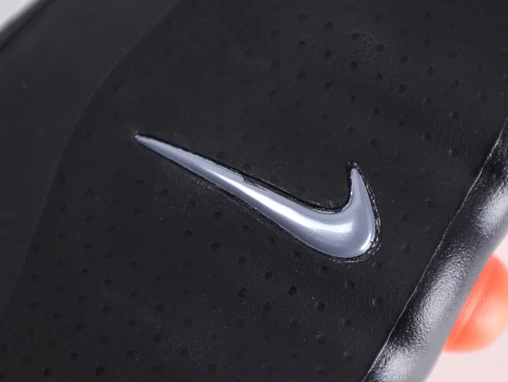 Black textured leather with a silver logo detail on the shoe surface.