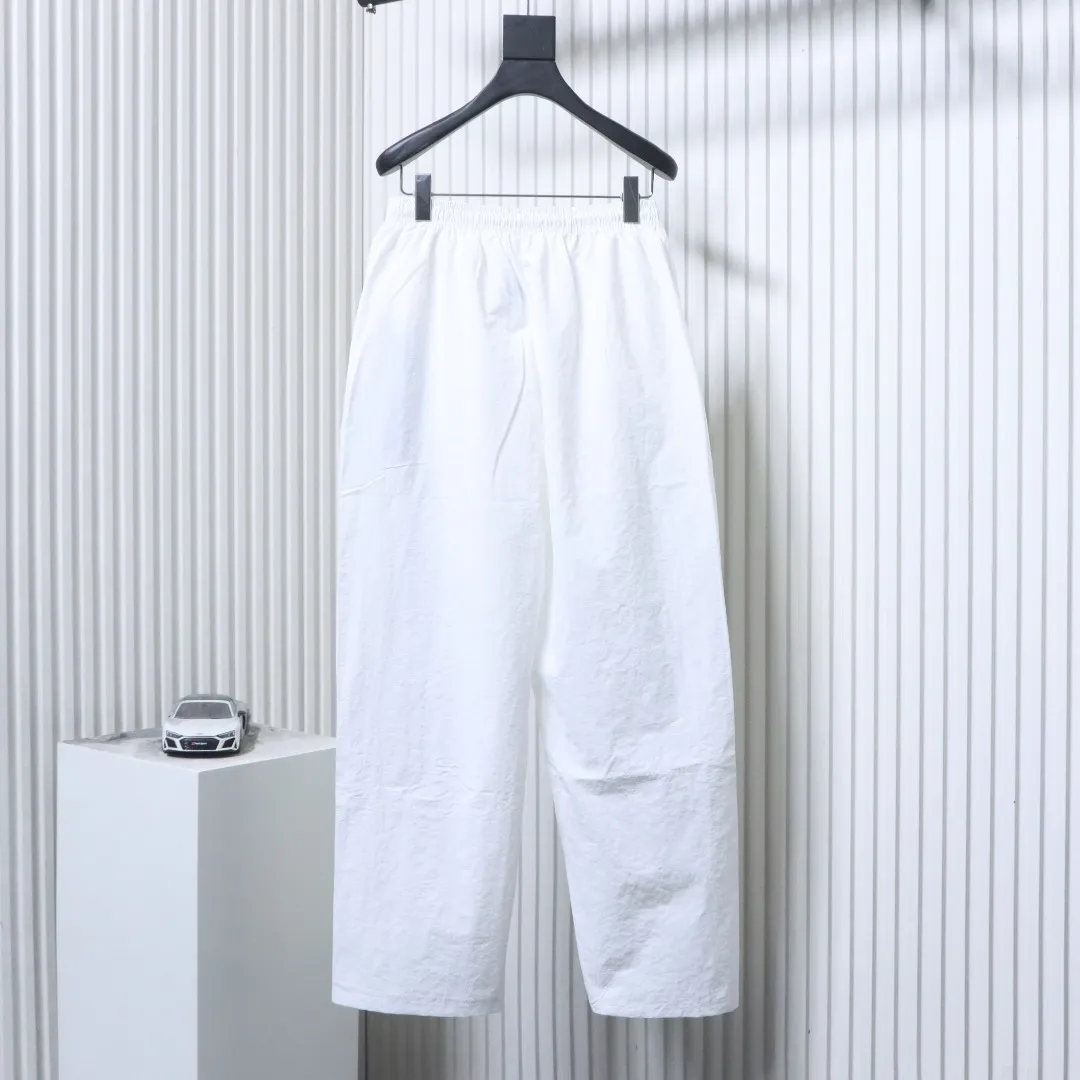 Back of BLCG Cursive Signature Embroidered Tracksuit Pants Color White