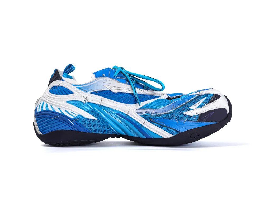 Blue and white athletic shoe, featuring mesh material and dynamic design accents.
