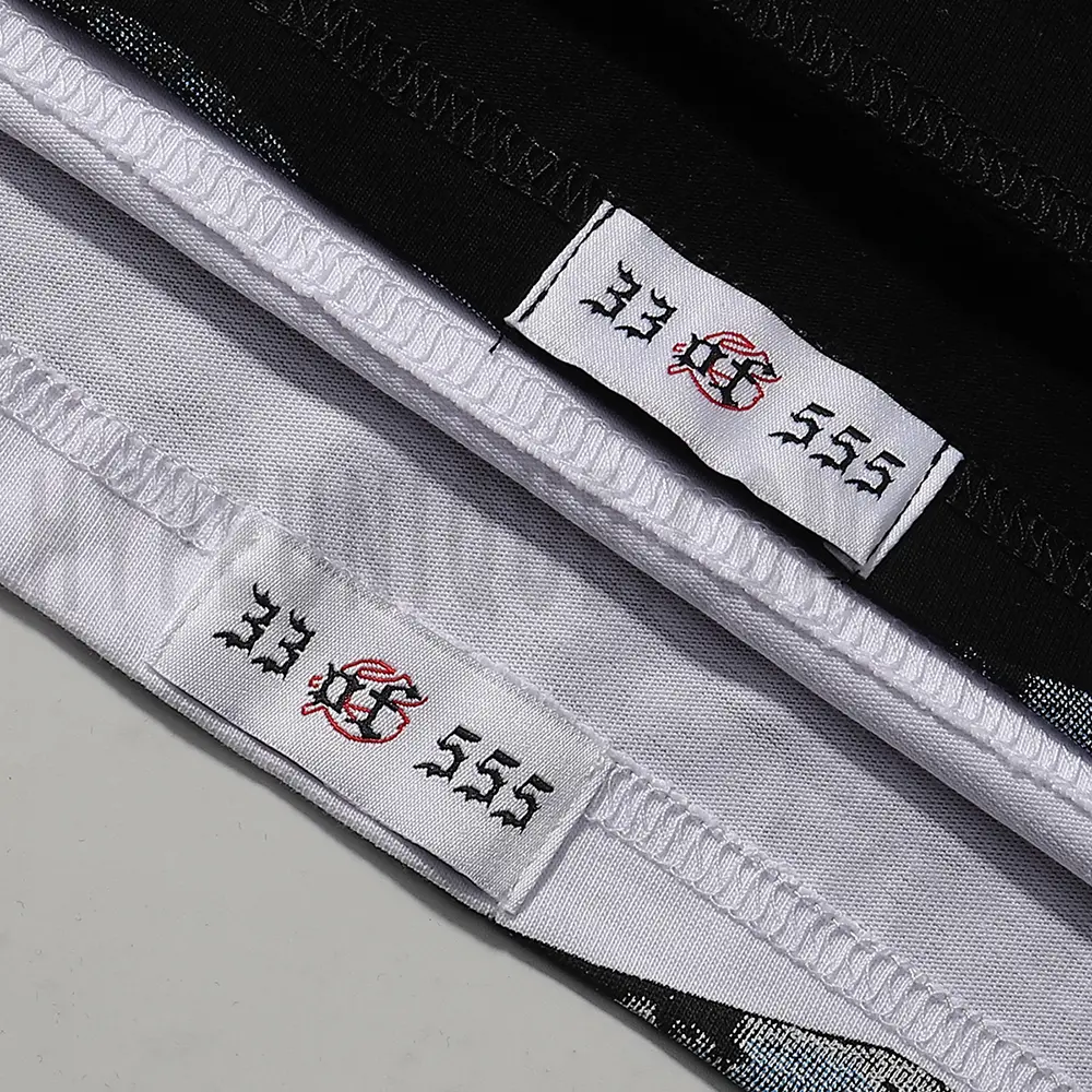 Clean hemline finish with a modern cut, highlighting the T-shirt's streetwear aesthetic.