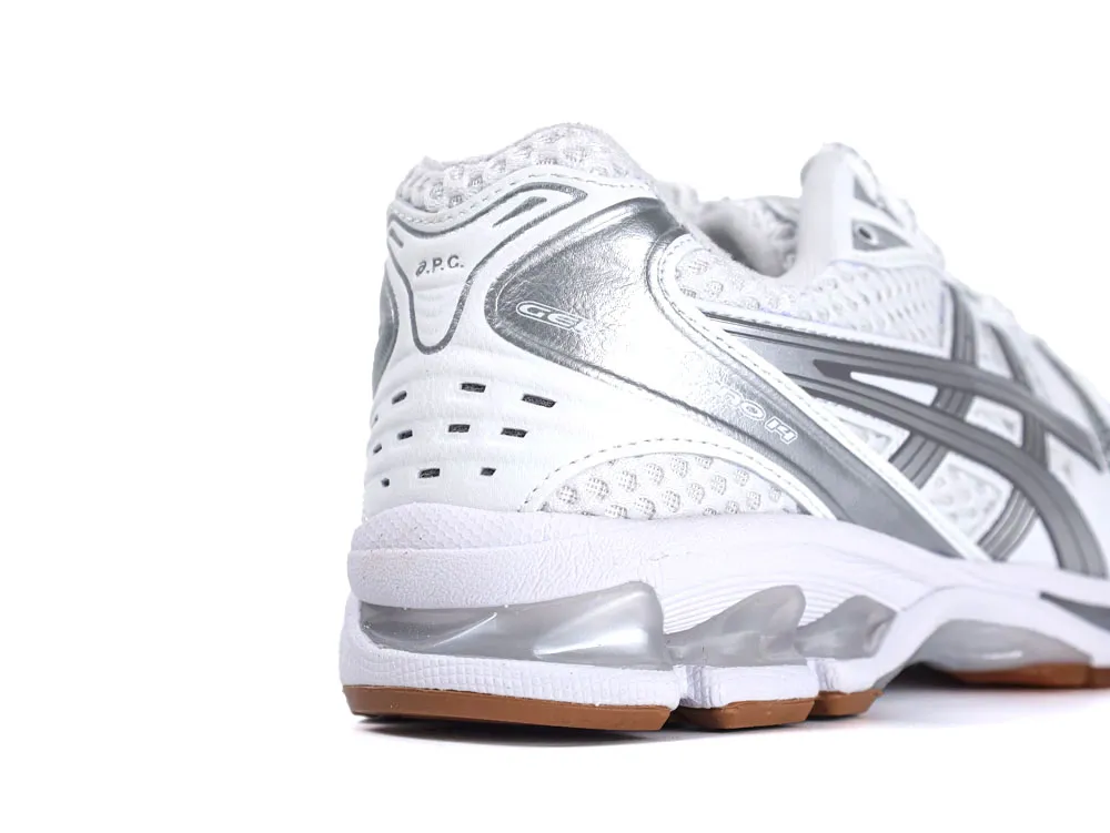 White and silver sneaker with mesh upper and rubber sole, featuring cushioned heel.