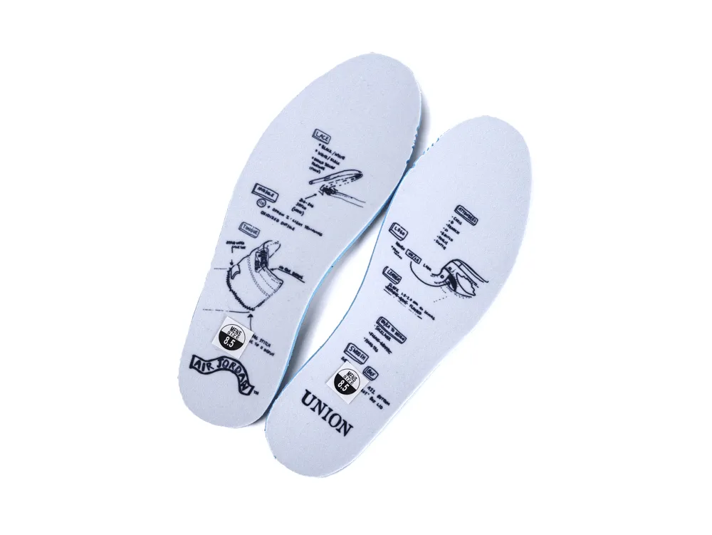 Two white foam insoles with black printed details and branding logos.