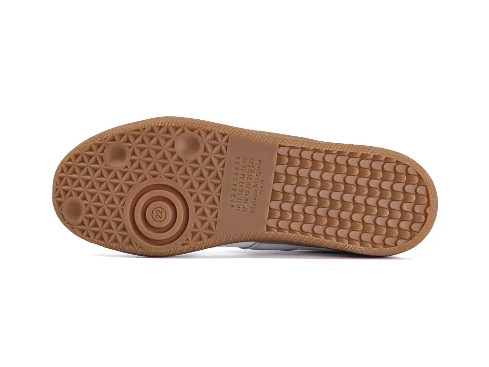 Brown rubber sole with textured pattern for enhanced grip and durability.