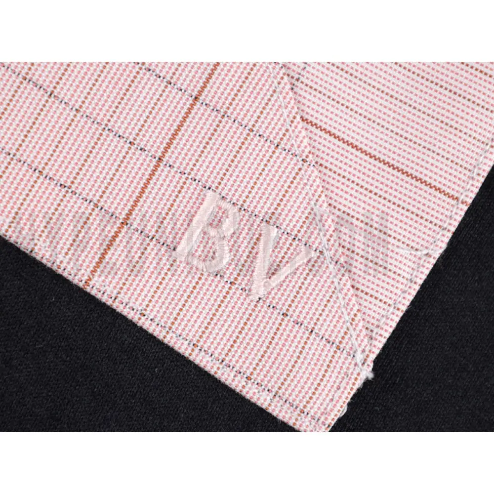 Embroidered graphic on the side of the T-shirt