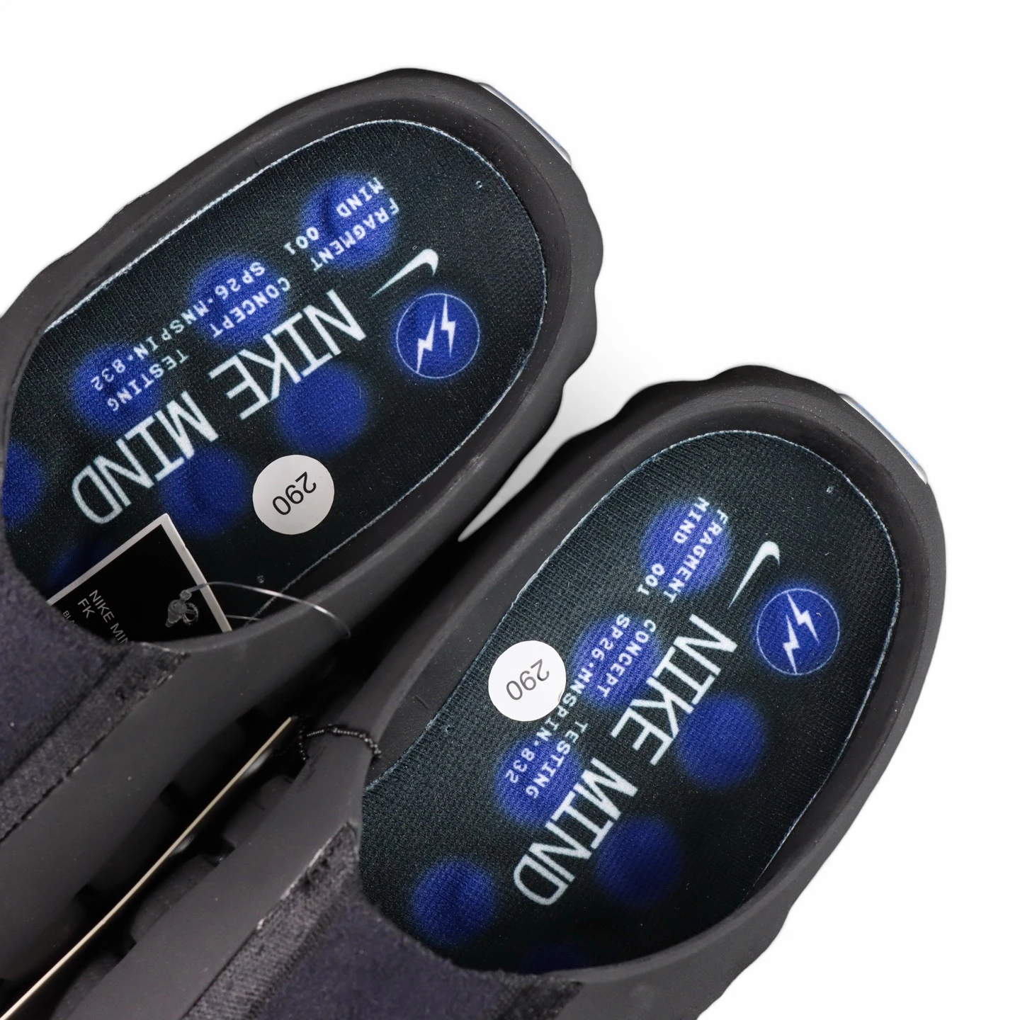 Black and blue shoe insoles, featuring synthetic material and brand details.