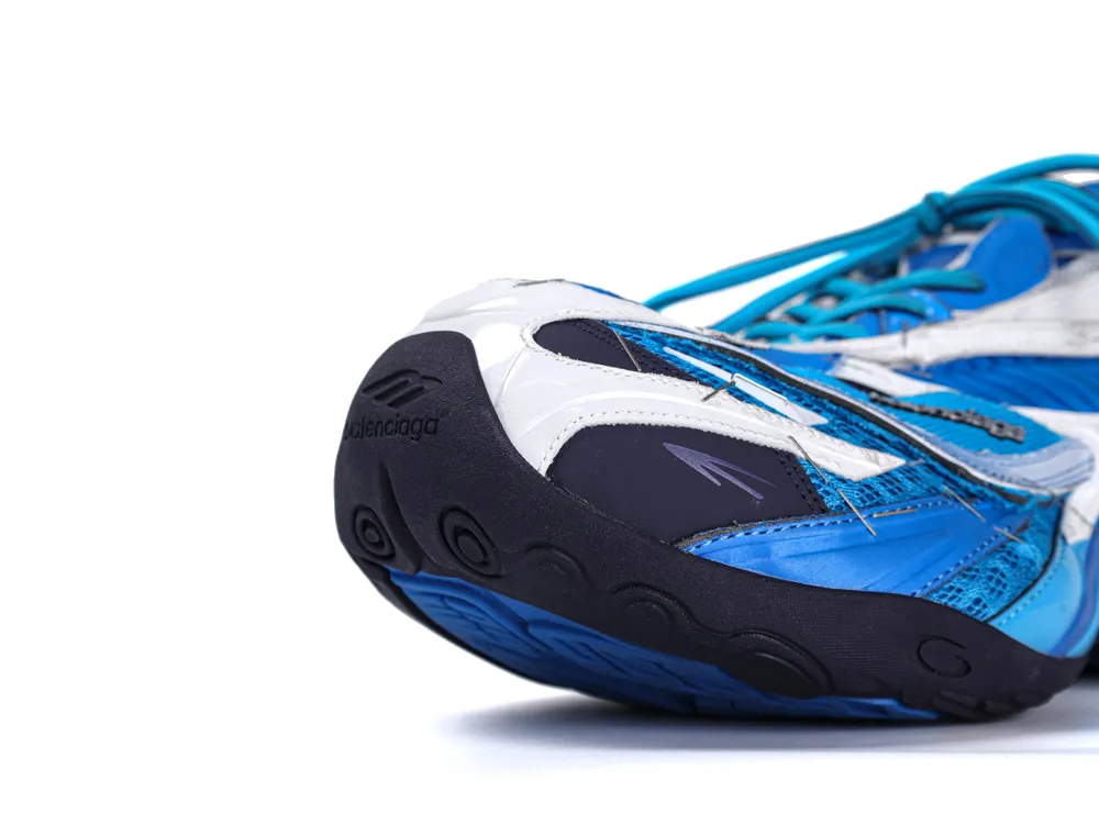 Blue and white sneaker with rubber sole and synthetic upper material.