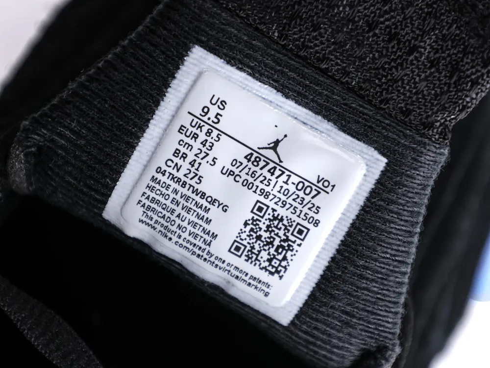 A black fabric shoe interior with a white label displaying size and manufacturing details.