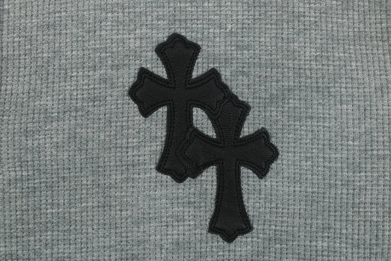 Black Cross Logo Detail