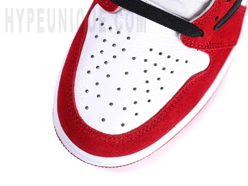 A close-up of the toe box, showing the red Mudguard and white toe box.