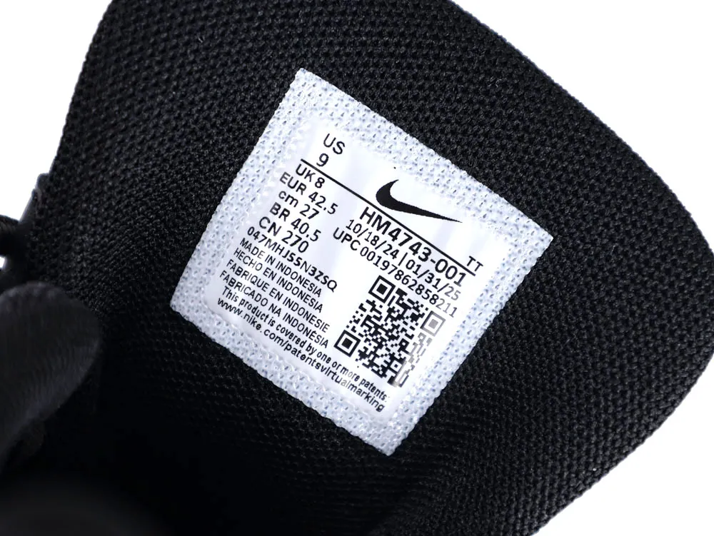 Black fabric shoe tongue with white label displaying product information and QR code.