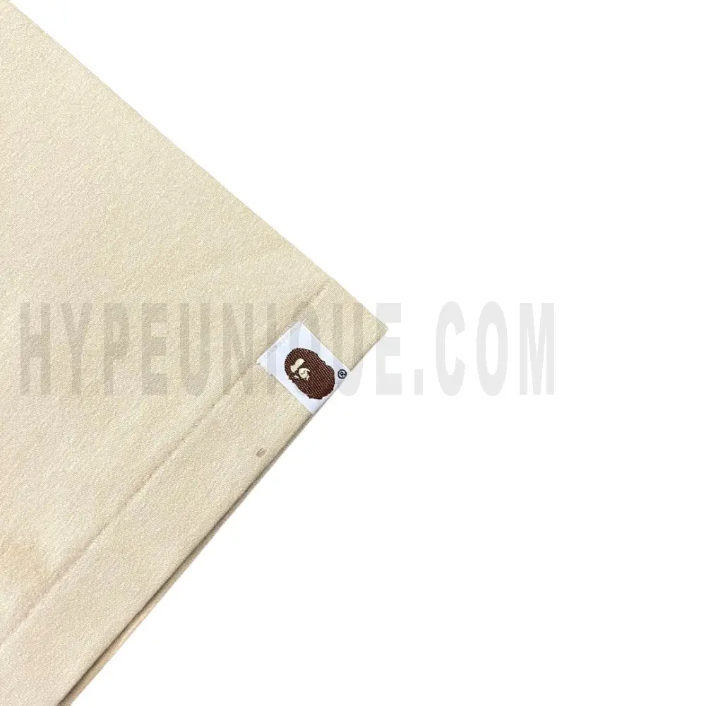 The sleeves of the beige clothes