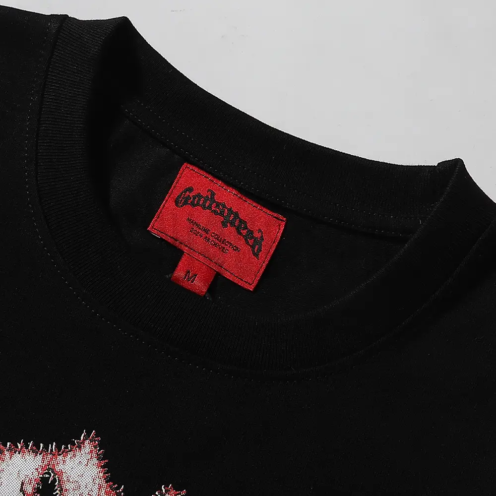 Clean hemline finish with a modern cut, highlighting the T-shirt's streetwear aesthetic.