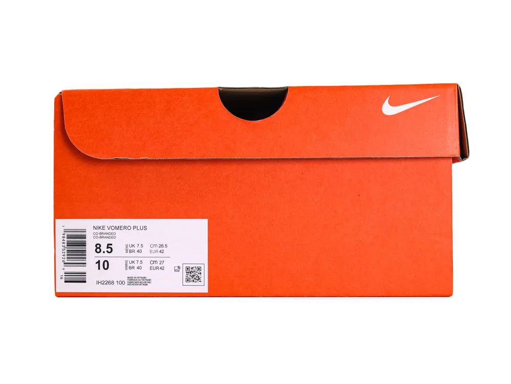 Orange cardboard shoe box with branding and product label on the side.