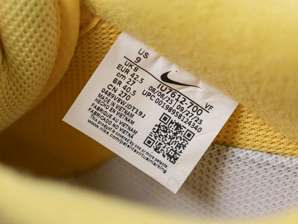 Yellow fabric with a white size label in a shoe interior.