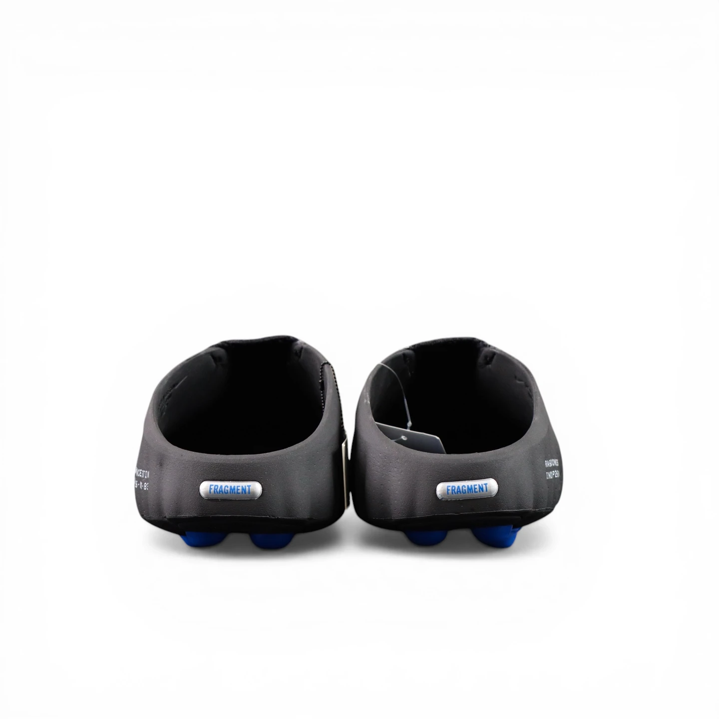 Black synthetic shoes with blue studs, viewed from the back.