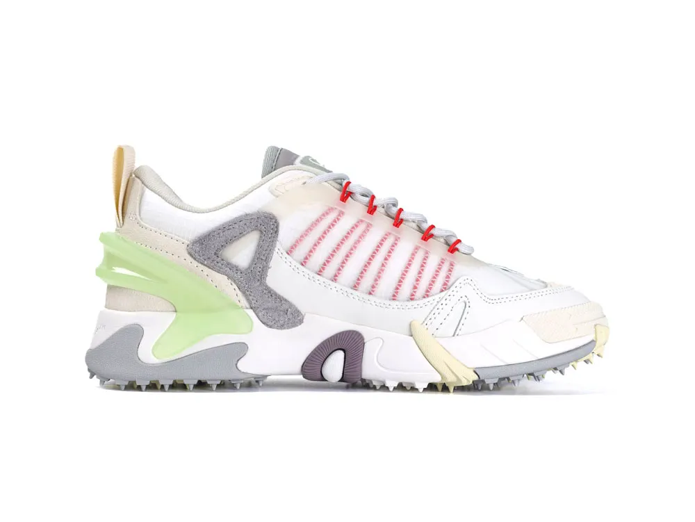 Multicolored sneakers with white leather, gray suede, and lime green accents, featuring textured sole.