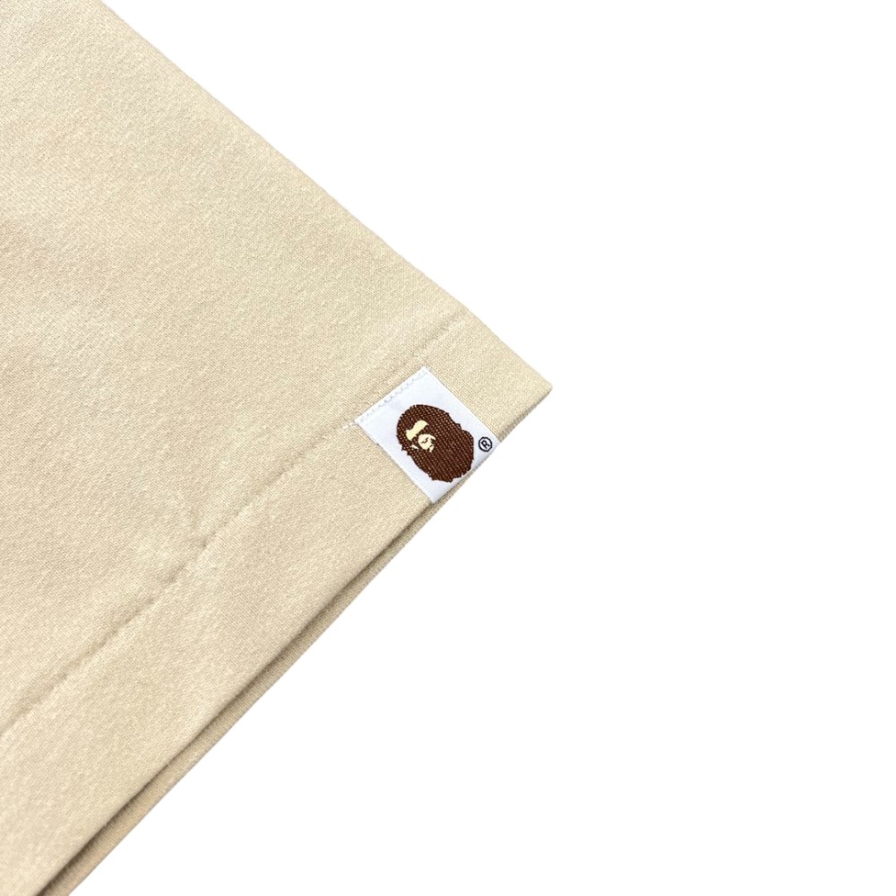 The sleeves of the beige clothes