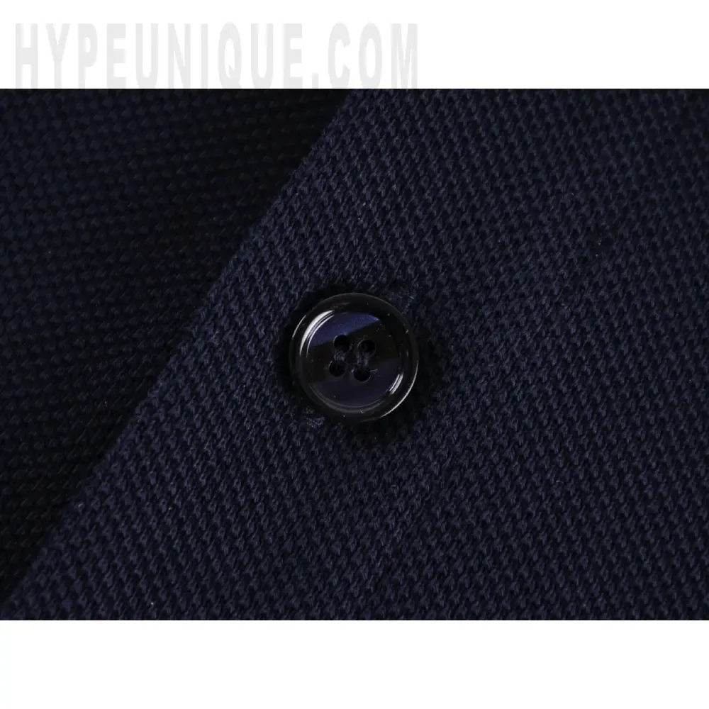 Close-up of button detail on the clothes
