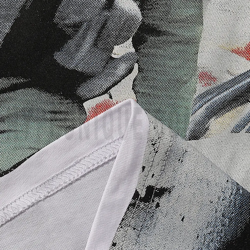 Clean hemline finish with a modern cut, highlighting the T-shirt's streetwear aesthetic.