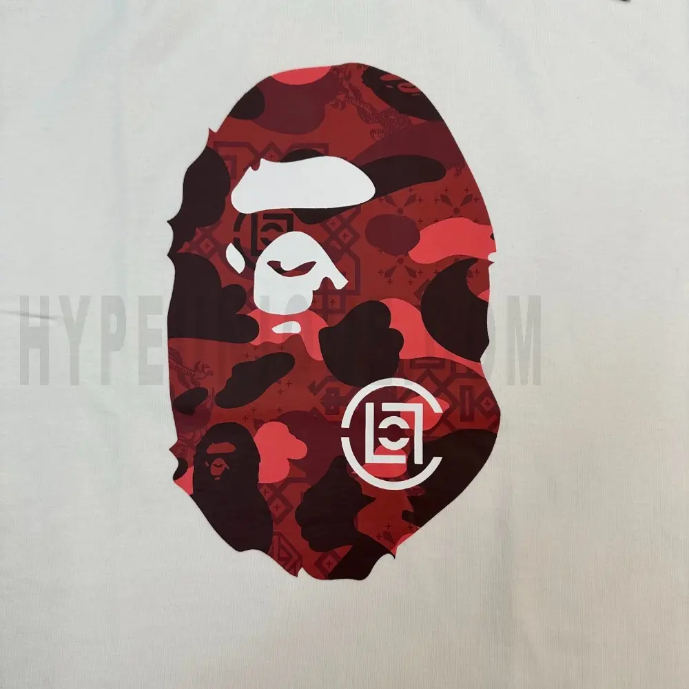 Detailed shot capturing the graphic print on the white tee's back panel.