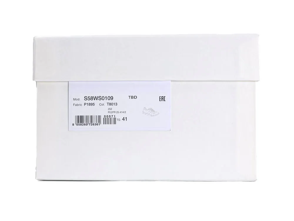 White cardboard shoe box with product label and barcode on the side.