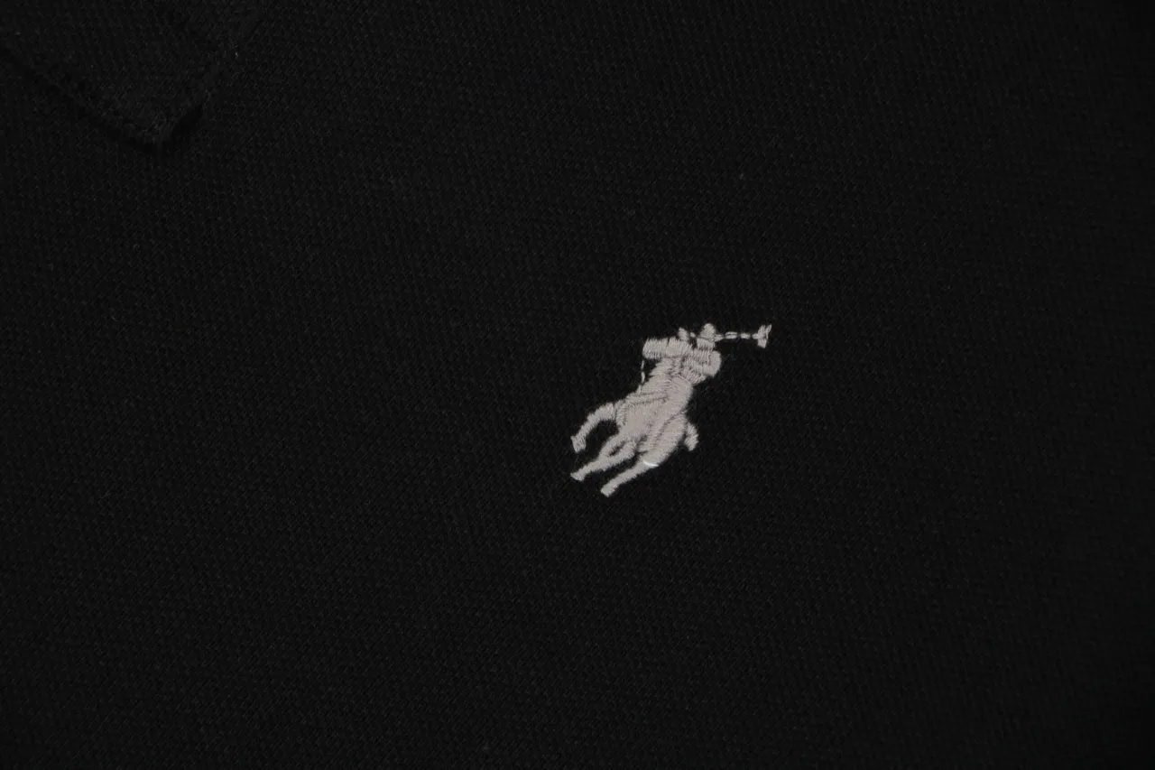 Black fabric with white embroidered horse logo