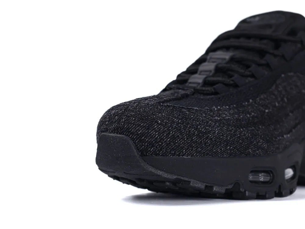 Black, textured sneaker with fabric upper and visible air cushioning in sole.