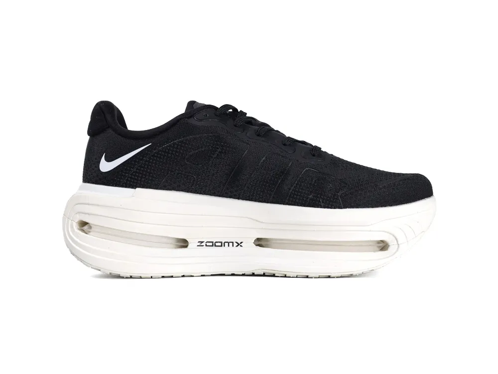 Black mesh sneaker with white cushioned sole featuring visible air units.