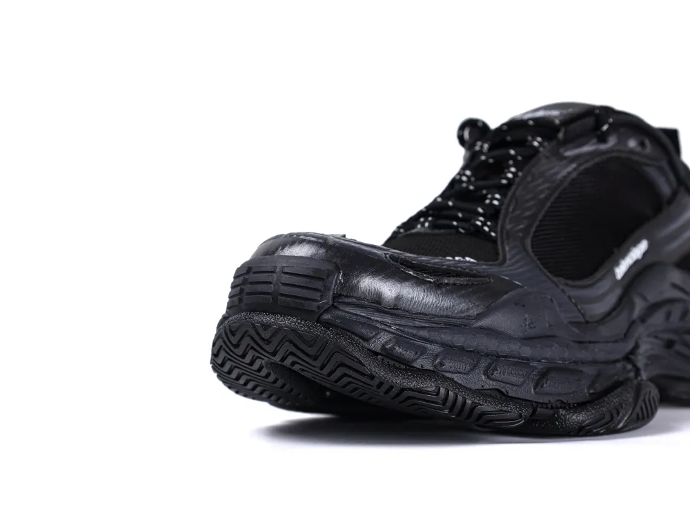 Black sneaker with rubber sole and mesh upper for durability and comfort.