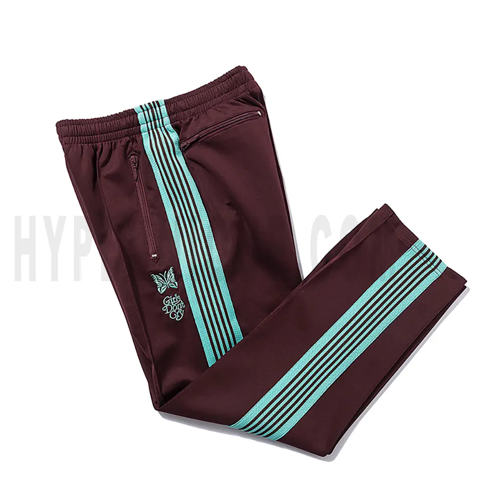 Side view of red track pants.