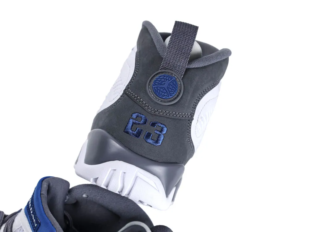 Dark grey and white sneaker heel with blue embroidery, textile material.