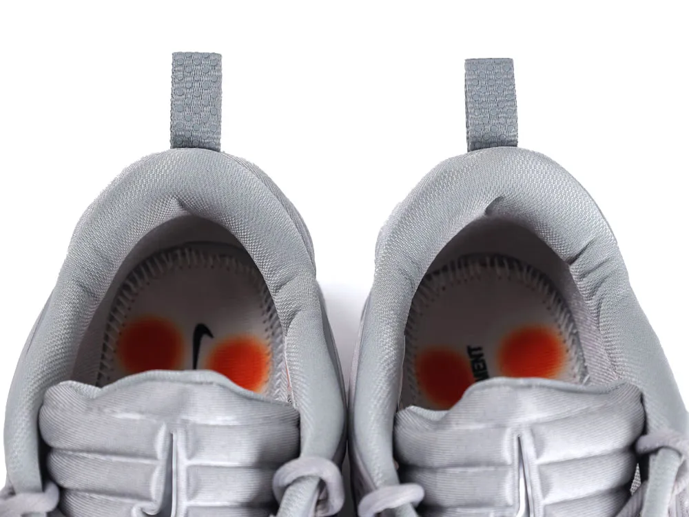 Gray fabric shoes with padded interiors and orange accented insoles.