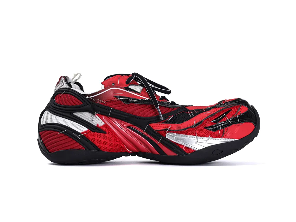 Red and black sneaker with mesh and rubber materials, featuring intricate silver accents.