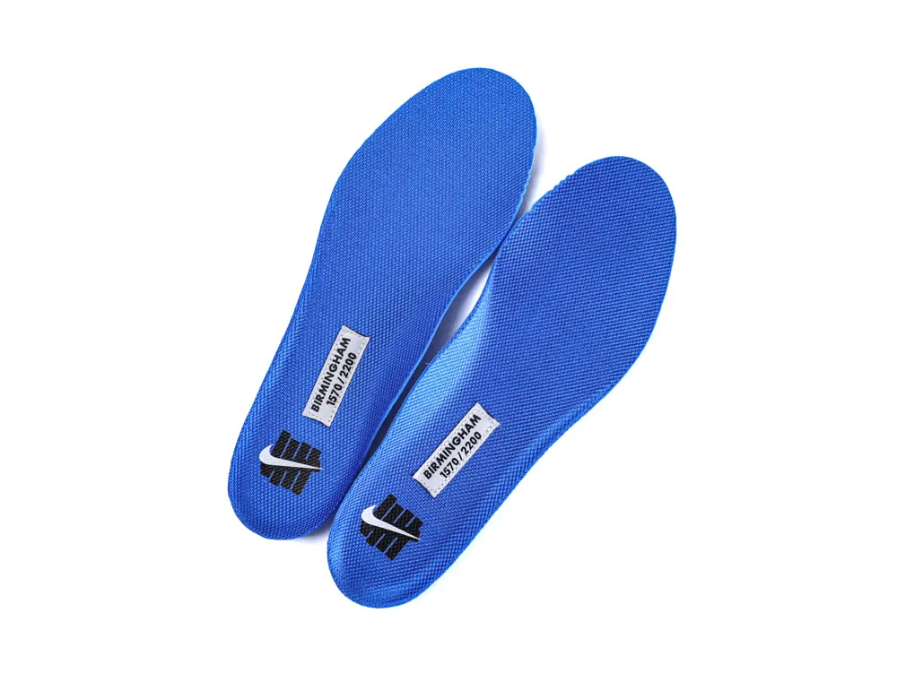 Blue fabric insoles displaying branding and product label, designed for comfort and support.