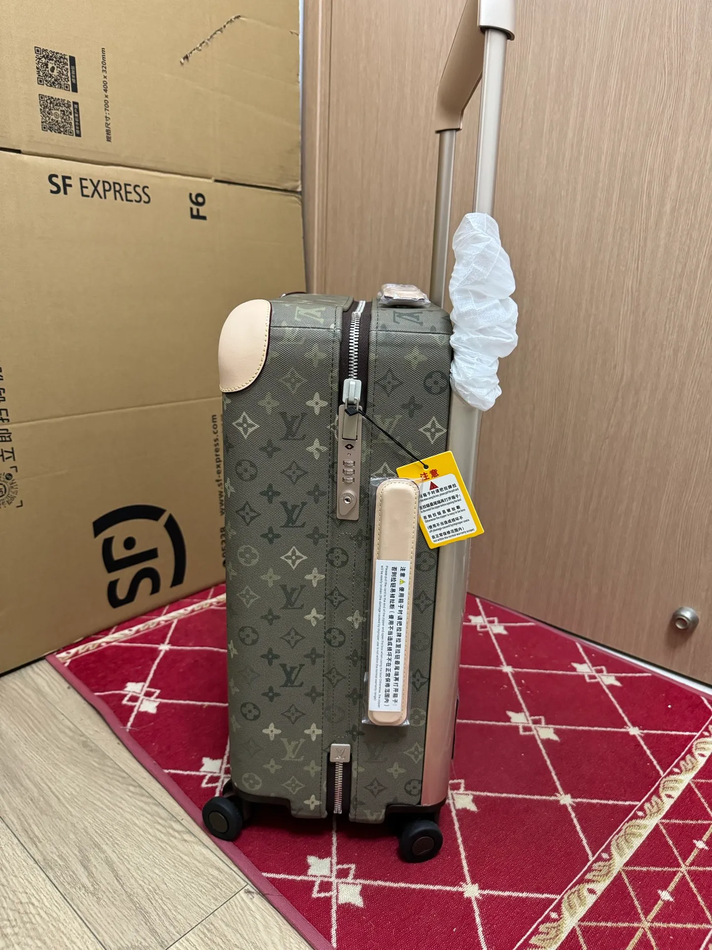 Monogram Khaki Green Horizon Rolling Carry-On Suitcase Side View With Combination Lock And Handle