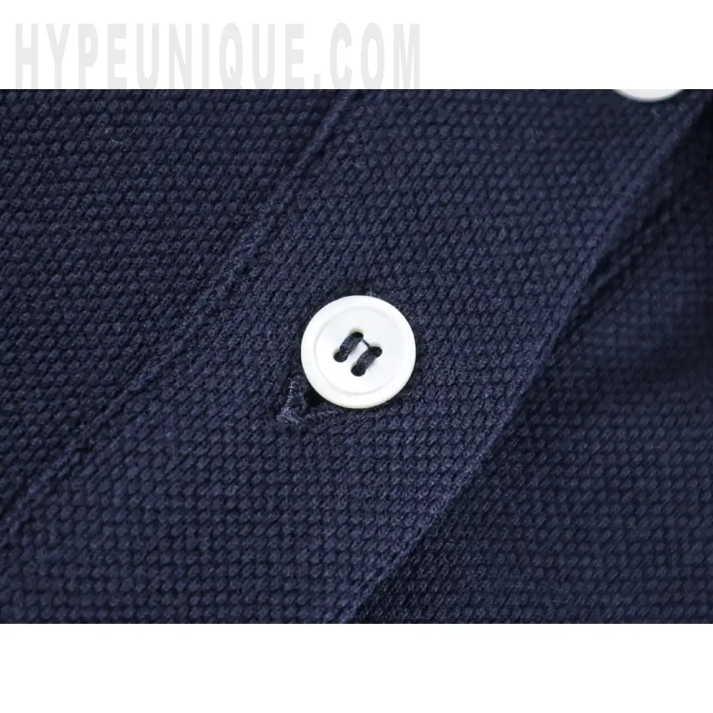 Close-up of button detail on the clothes
