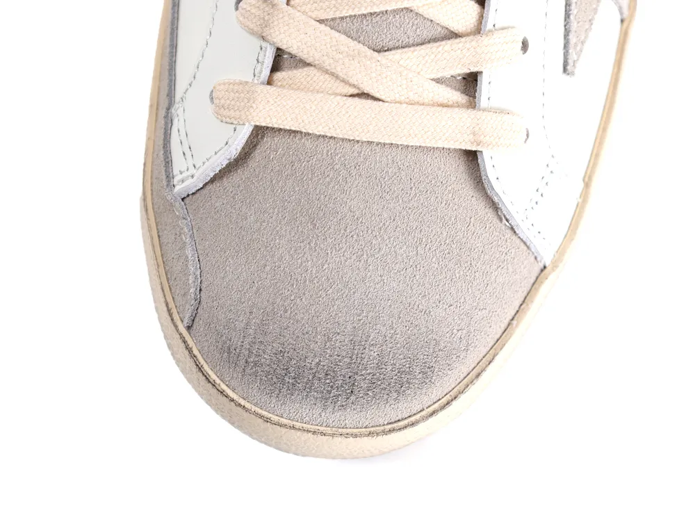 Top view of white Golden Goose Super Star sneaker with grey suede toe