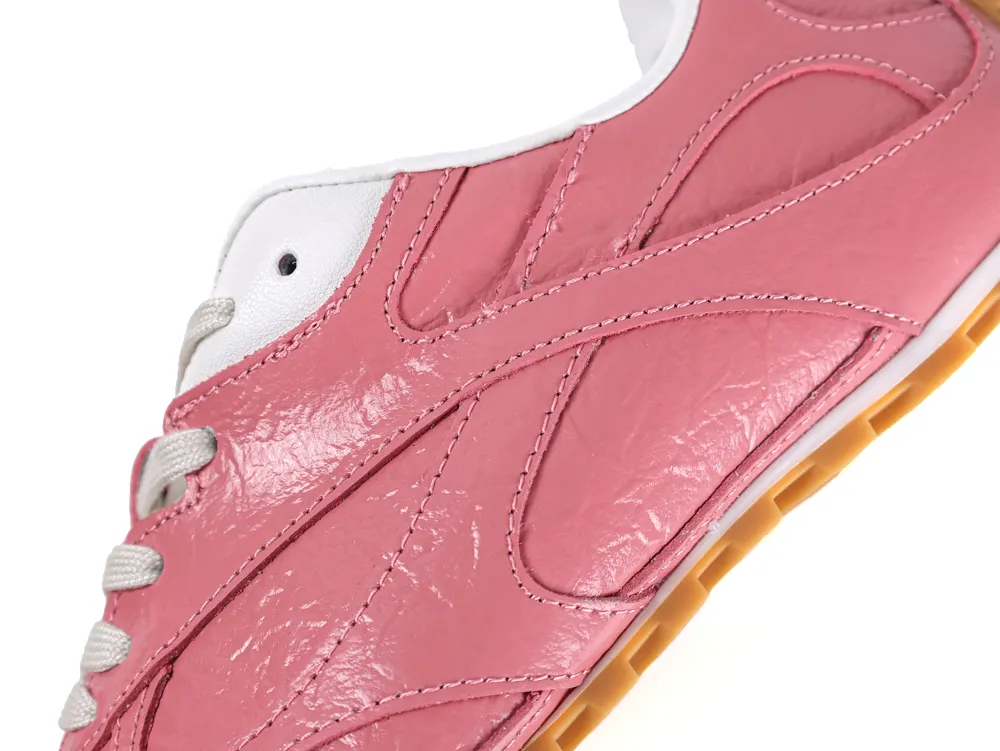 Close-up of the Barolo pink leather side panels showing the stitched overlays and gum outsole edge.