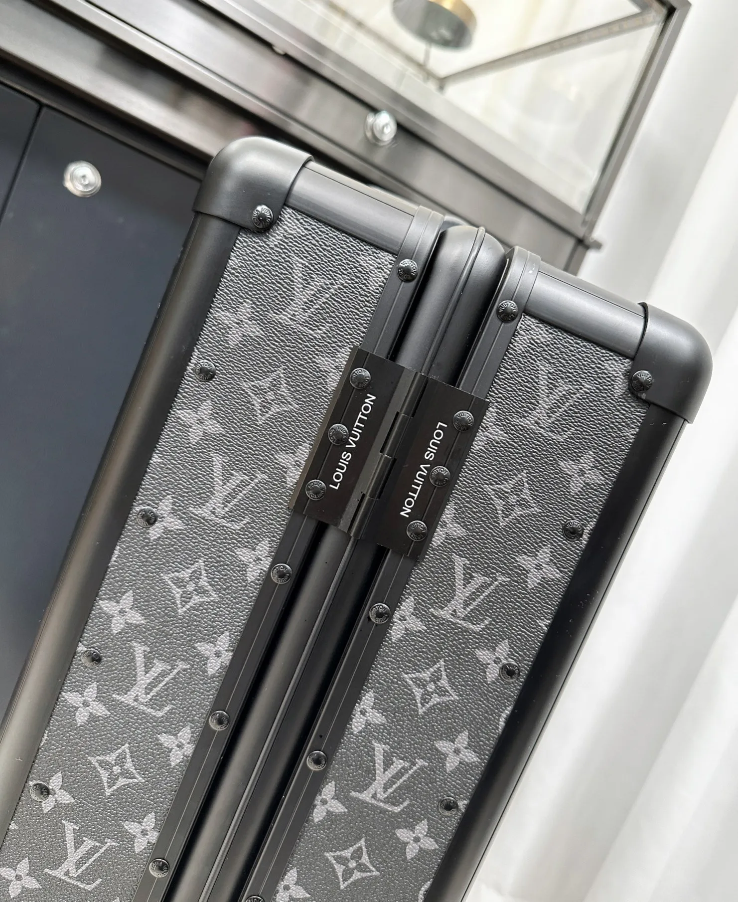 Monogram rolling luggage frame detail
