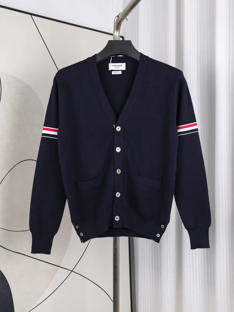 A front view of the Fine Merino Wool RWB Armband Cardigan in navy, showcasing its deep navy merino wool material.