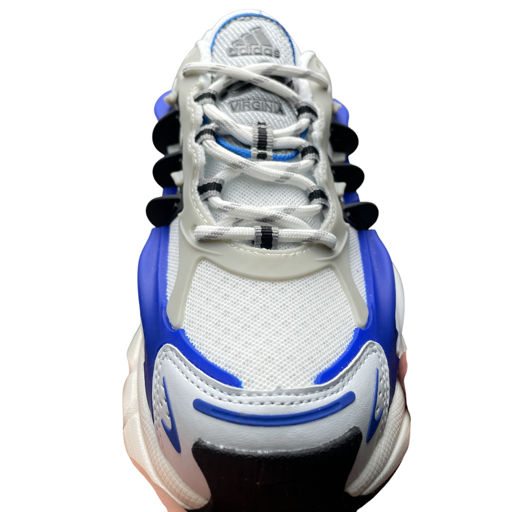 Close-up of a sneaker with white mesh, blue and black accents, intricate lacing, and a textured and layered design.
