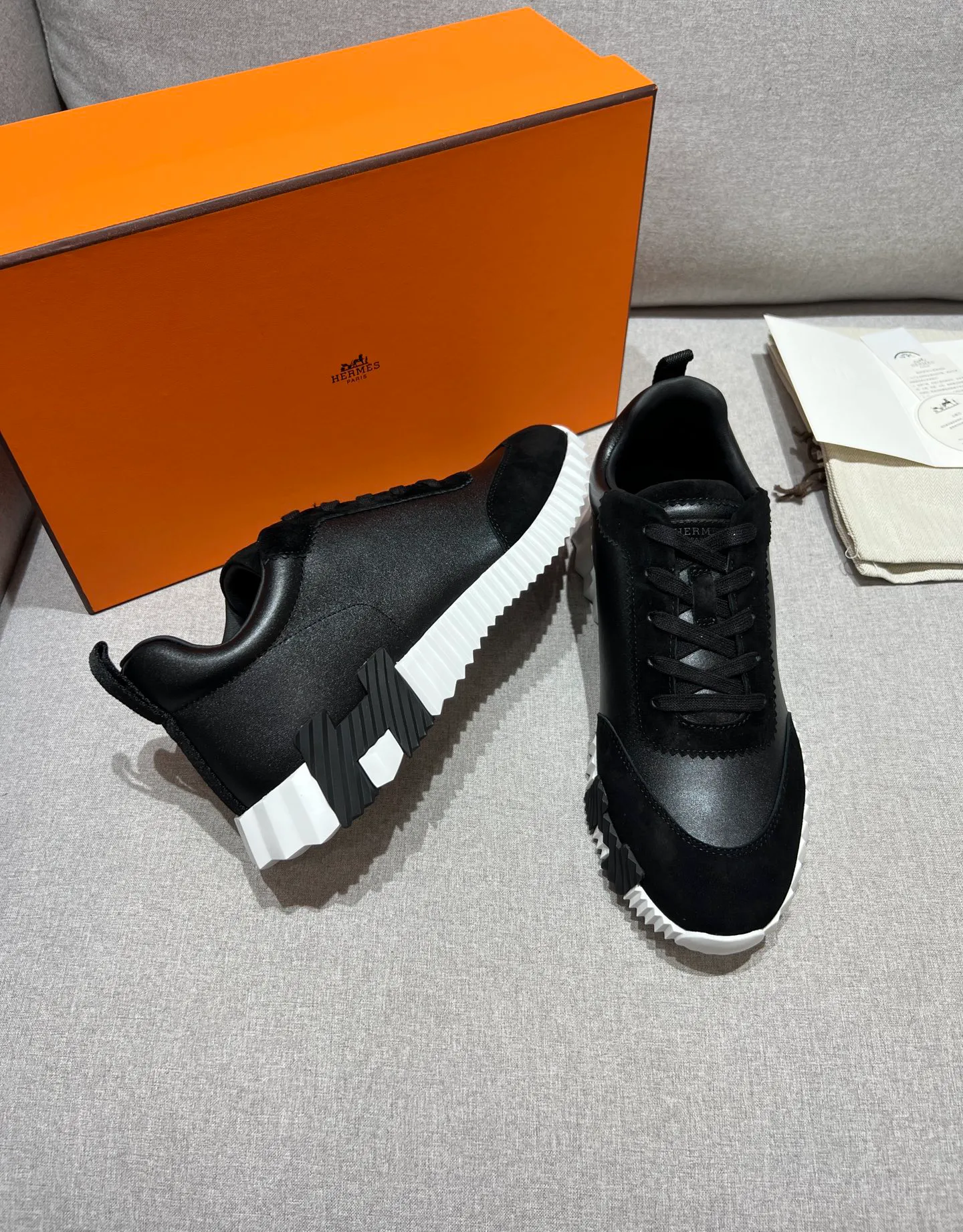 Front View and Side View of Black Bouncing Suede Leather Sneakers