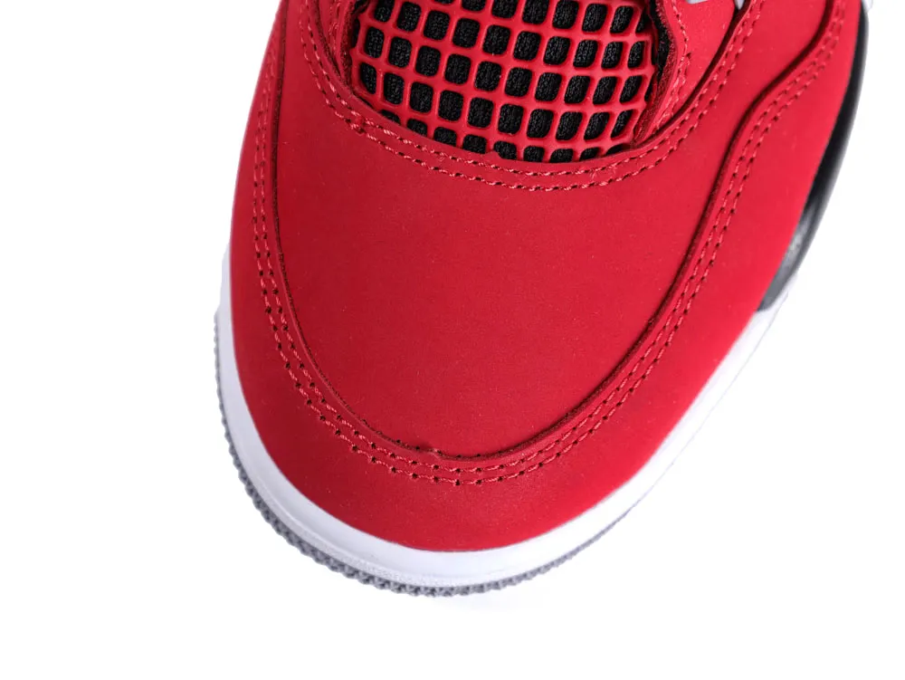 Red sneaker toe with black mesh and white sole, showcasing stitched leather details.