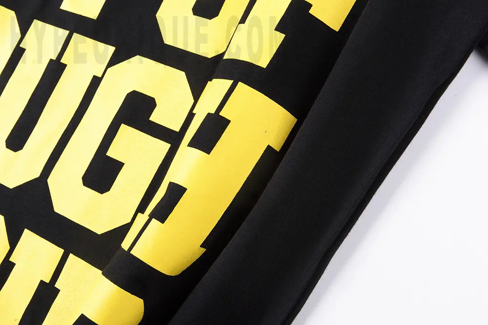 Front view of the black That’s A Awful Lot of Cough Syrup Bear Dropout T-shirt, showcasing the yellow text logo.
