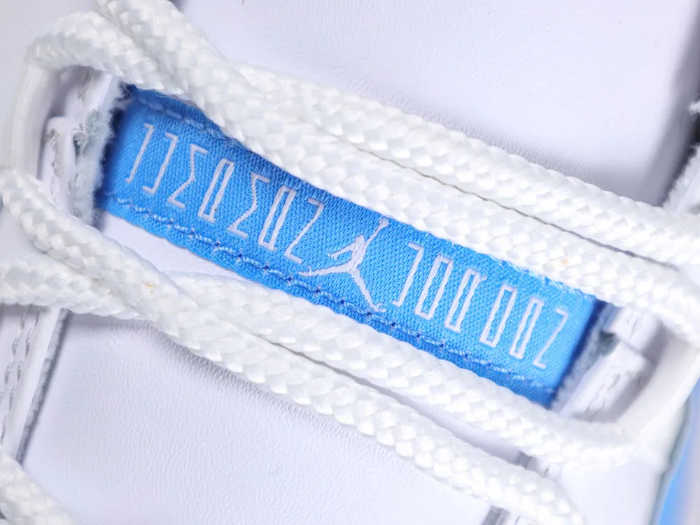 Close-up of white shoelaces on a white-blue fabric sneaker tongue.