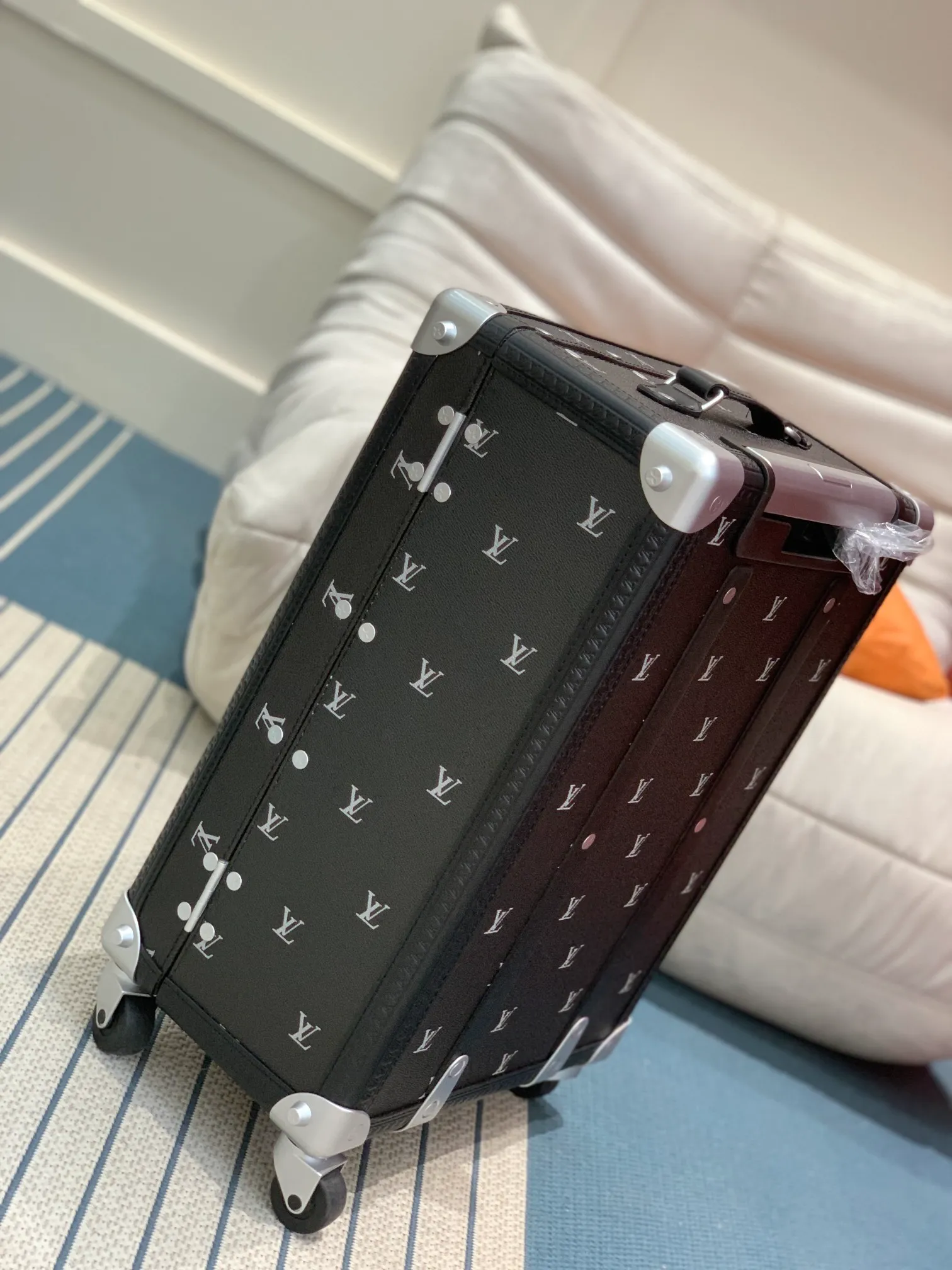 Rolling Trunk Black Monogram Carry-On Suitcase Side And Corner Detail